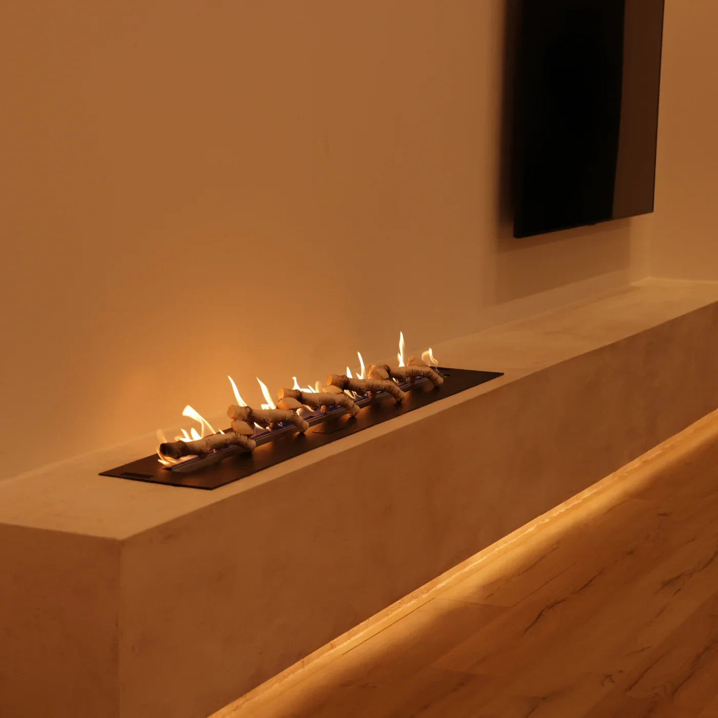 Image of A Bio Ethanol Fireplace Built into a Furniture Next to the TV